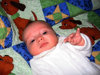 Alexander on his quilt