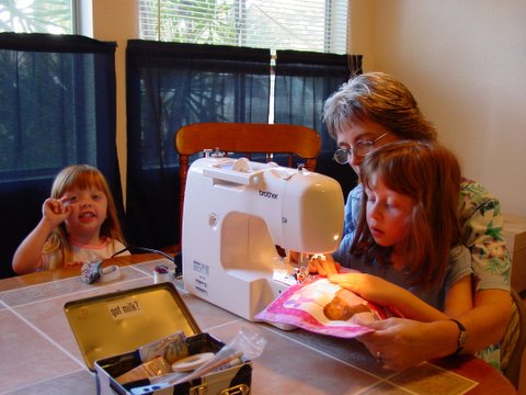 Emma sews with Grandma