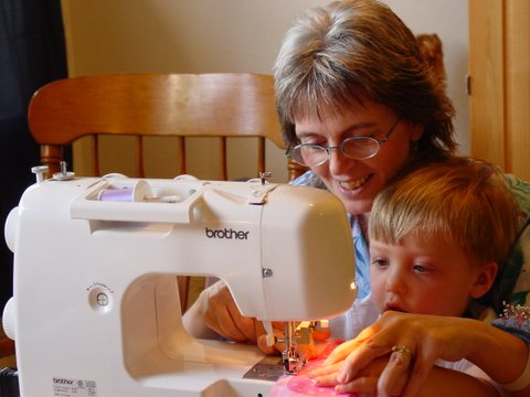 Even Nic sews with Grandma